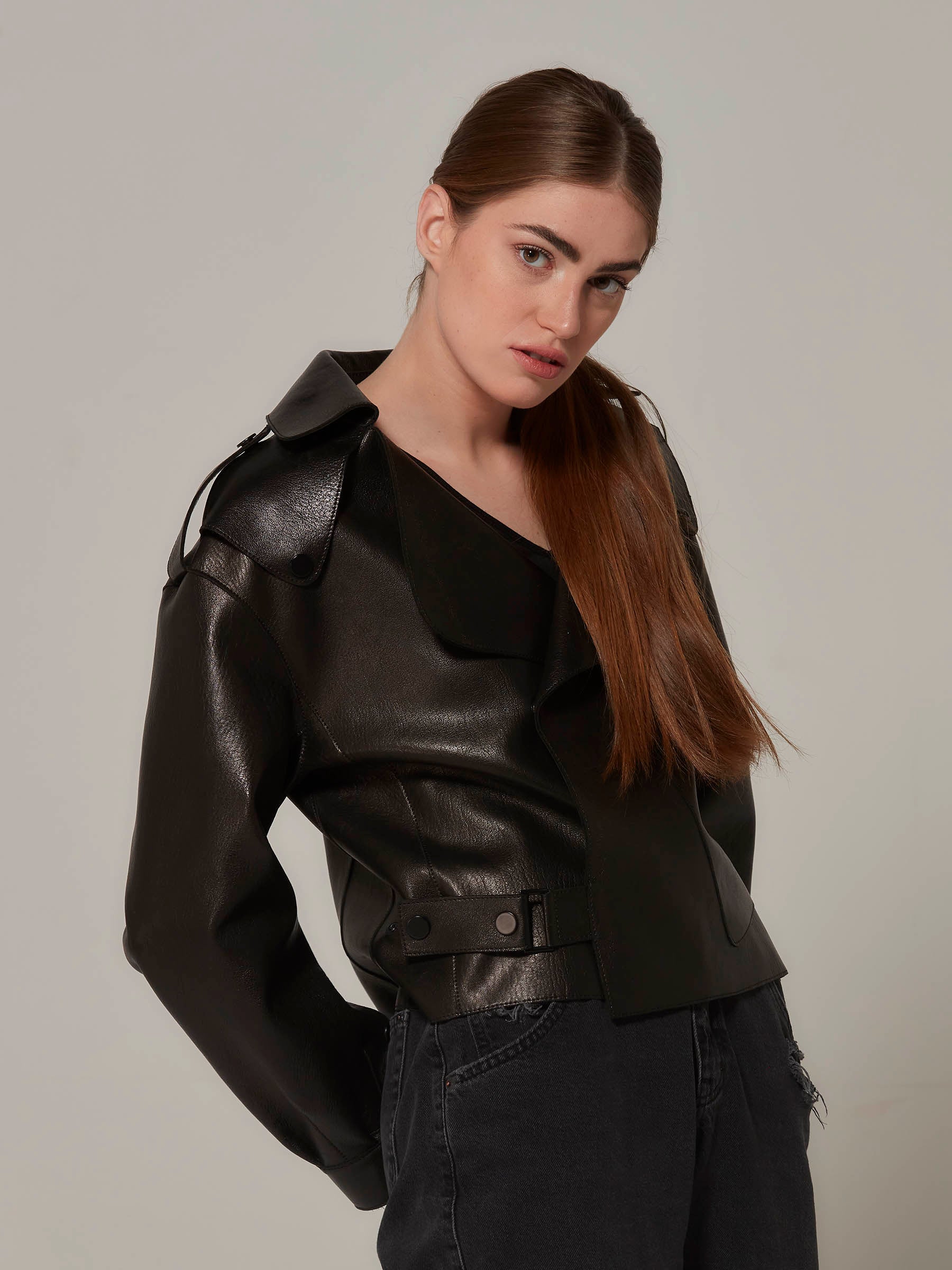 Black Oversized Leather Motorcycle Jacket - Minimalist Design front poseing